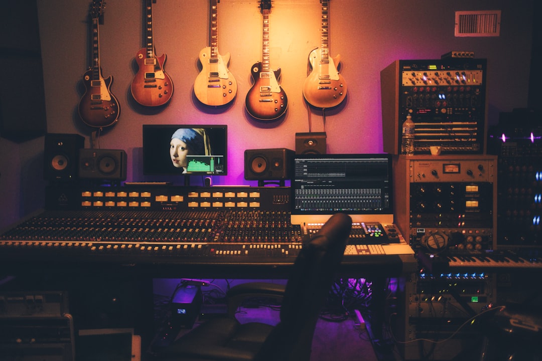 Closet studio wardrobe voice over recording setup with microphone and acoustic treatment
